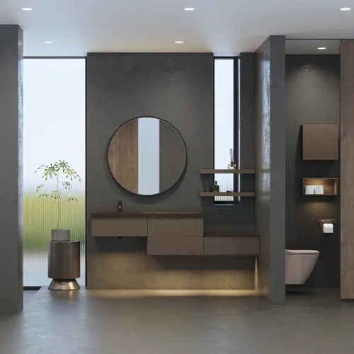 Stilrent og rummeligt badeværelse inspiration med stort rundt spejl med sort ramme, mørk stenvask, farvet toilet, overskab og åben reol i et sofistikeret og dæmpet design